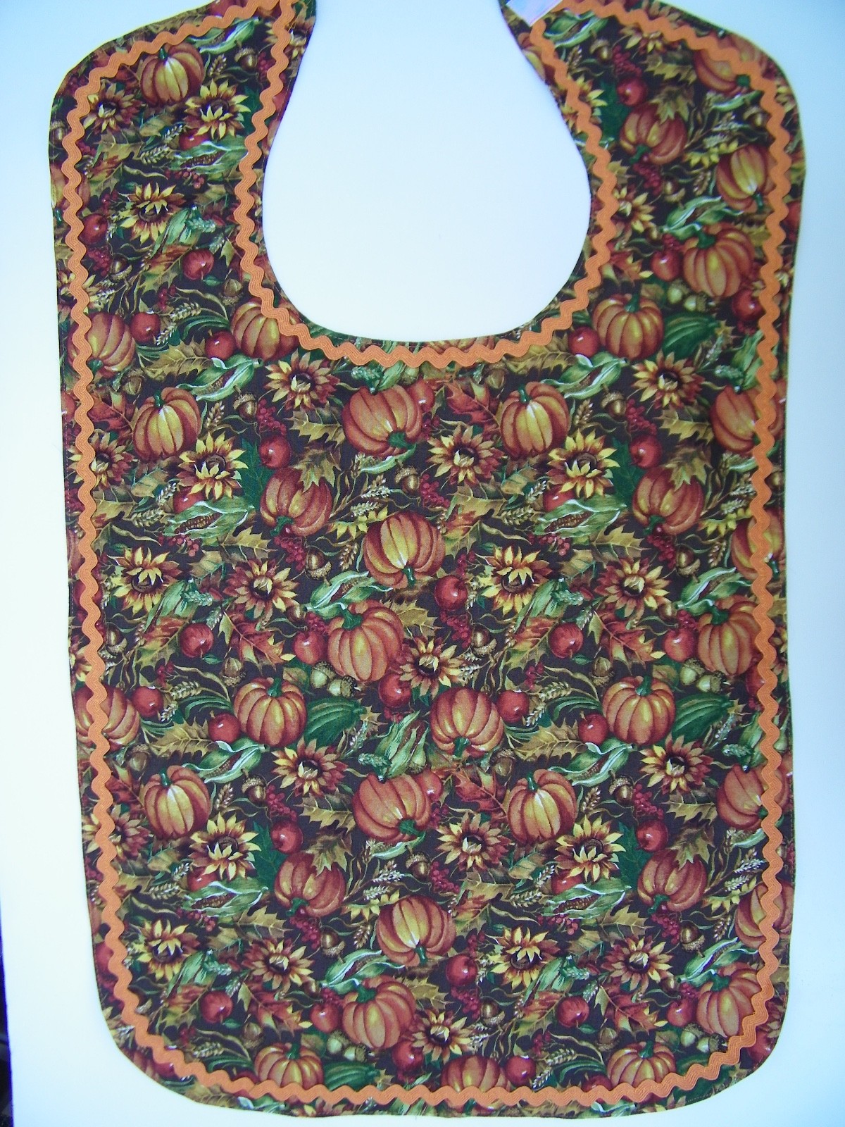 ADULT CLOTHING PROTECTOR BIB (STRAW FLOWERS & PUMPKINS)