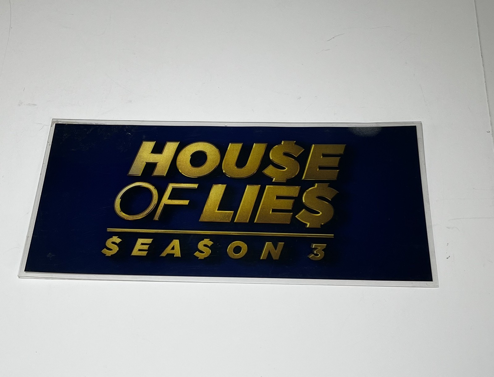 2 “House of Lies” laminated parking placards from season 1 and season 3